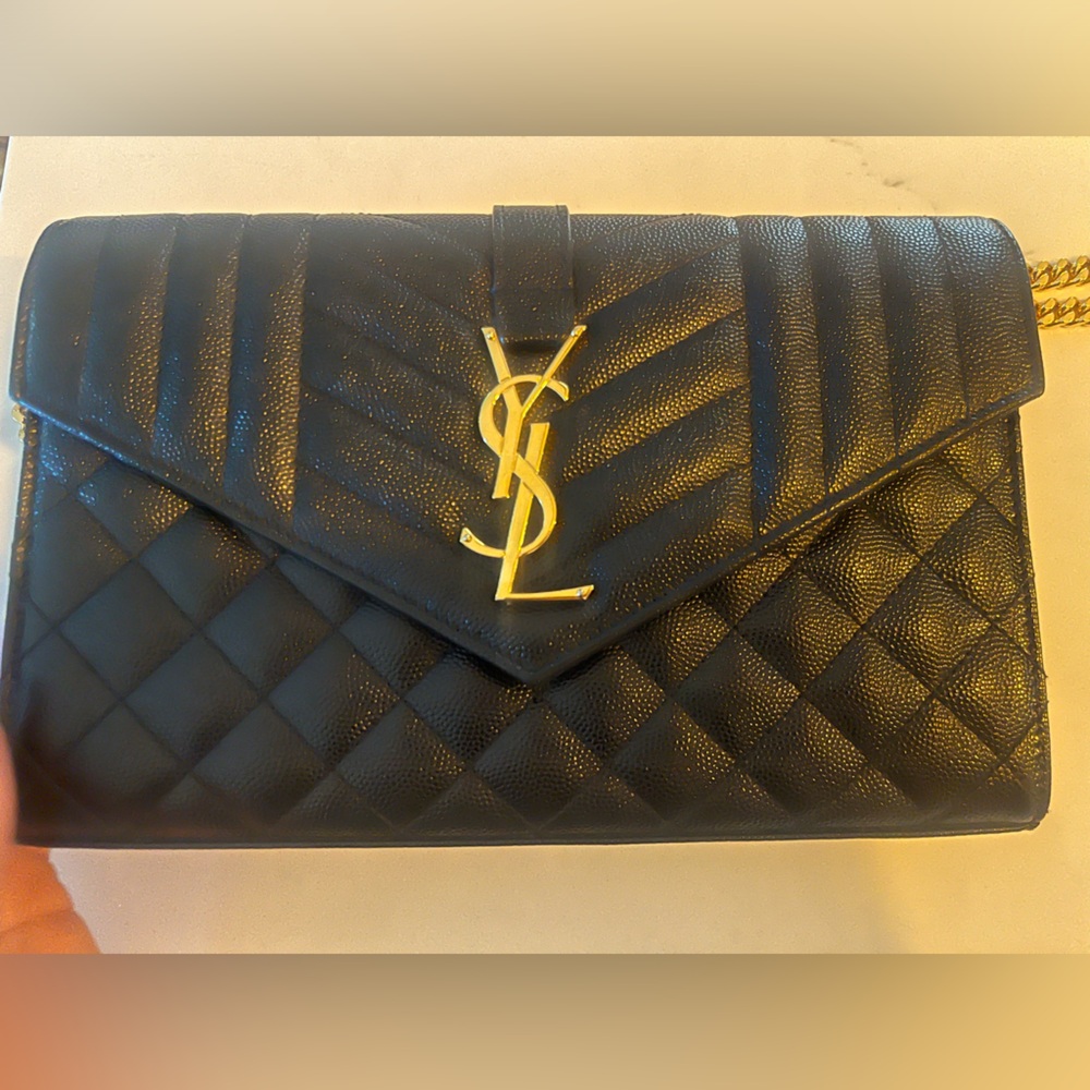 SAINT LAURENT
Cassandre Envelope Chain Caviar textured-leather wallet